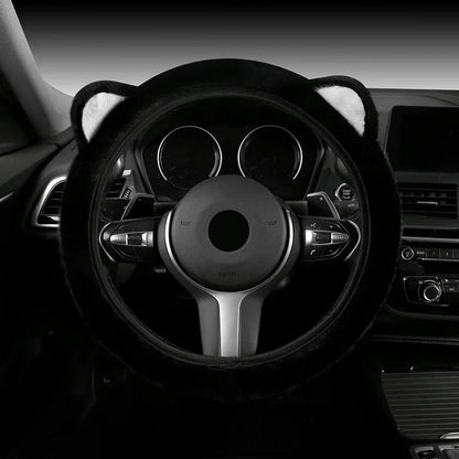 Plush cat ear steering wheel cover black with white ear tips installed on car steering wheel