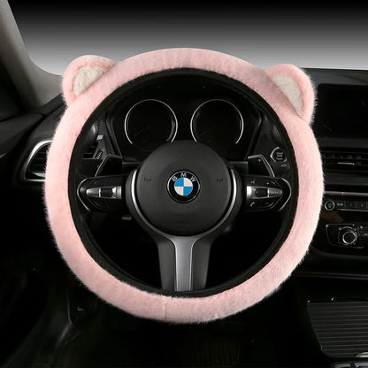 Plush cat ear steering wheel cover solid pink installed on BMW steering wheel