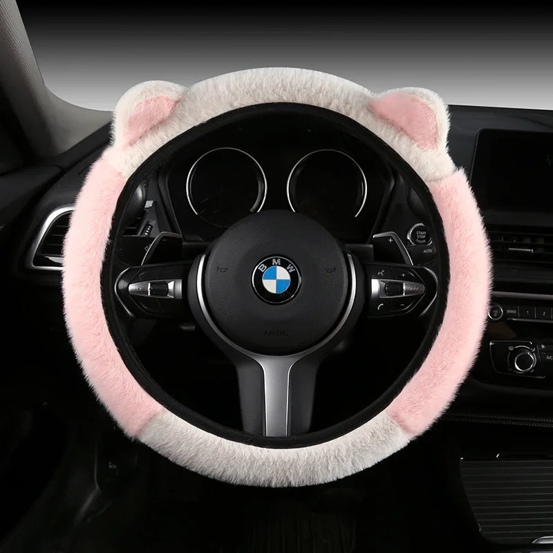 Plush cat ear steering wheel cover white with pink top section installed on BMW steering wheel
