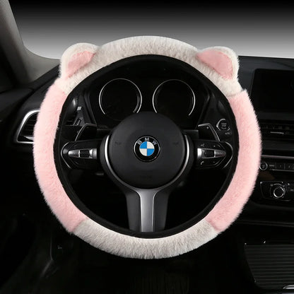 Plush cat ear steering wheel cover white with pink top section installed on BMW steering wheel