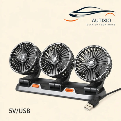 Portable 3-head USB 5V car dashboard fan with silver-black blades black base orange power button and USB-A cable on beige background
