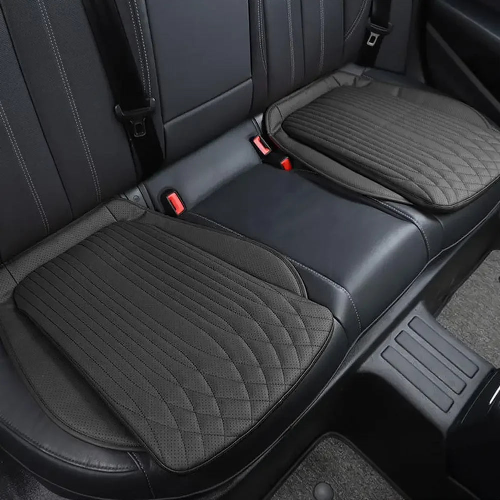 Black PU leather seat cushions on rear car seat, pair installed side by side