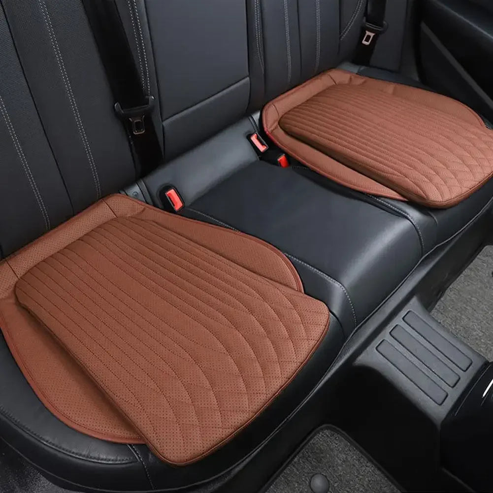 Brown PU leather seat cushions on rear car seat, pair installed side by side