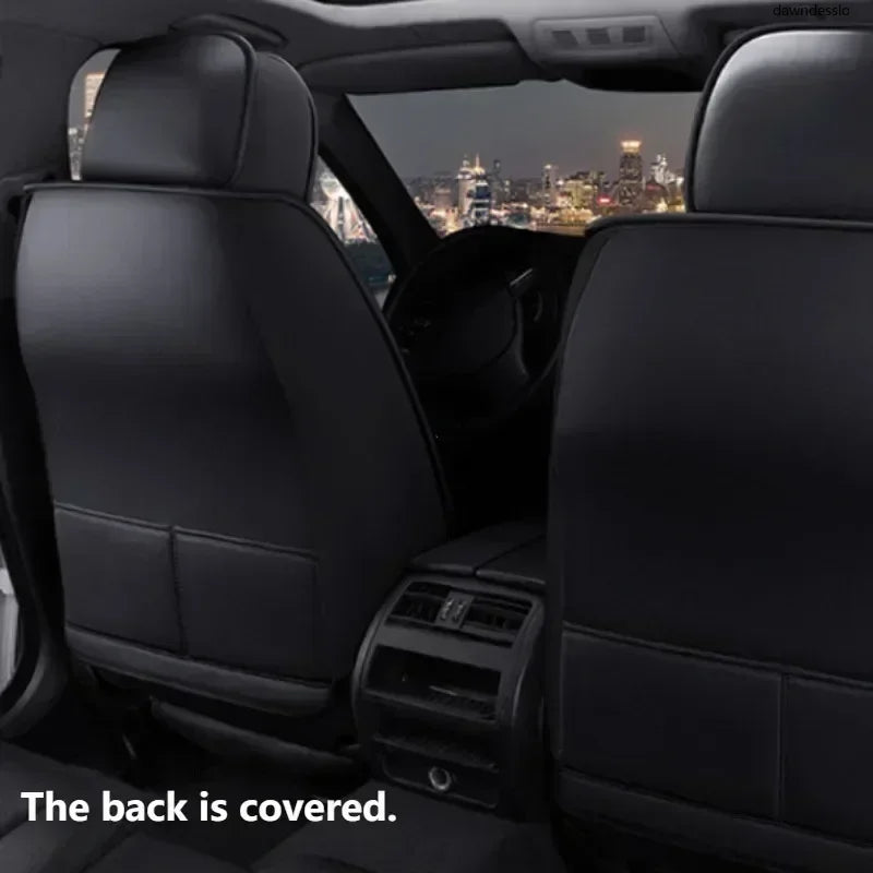 Installed PU leather car seat covers fully covering the back of front seats in a sedan