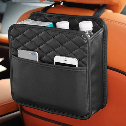 Black quilted PU leather car seat back organizer hanging on headrest with bottles and phones