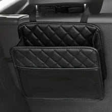 Black PU leather seat back organizer hanging empty on car headrest – side view