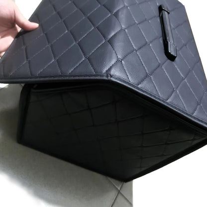 PU leather trunk organizer lid open showing quilted interior and carry handle