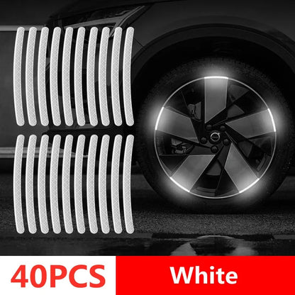 40PCS white reflective wheel rim tape strips with diamond pattern showing bright white night glow on car alloy wheel