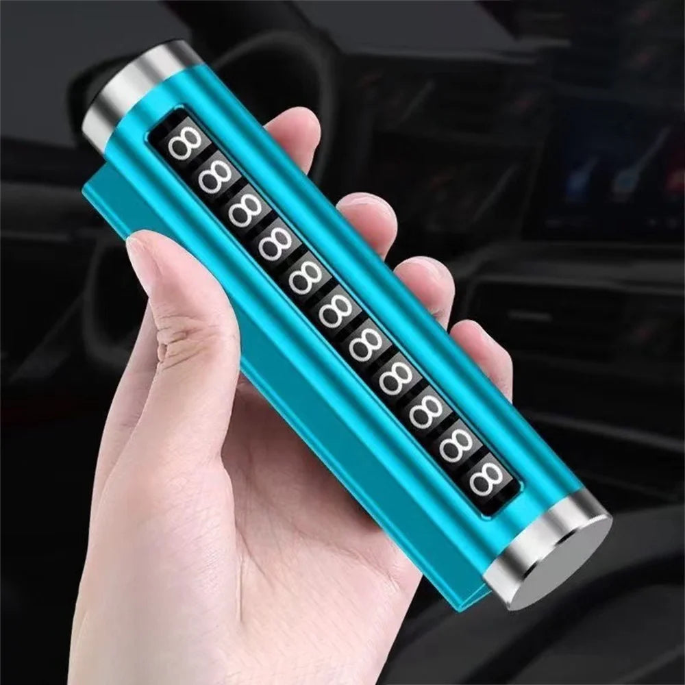Blue metal rotating car parking number plate held in hand at angle with car interior background