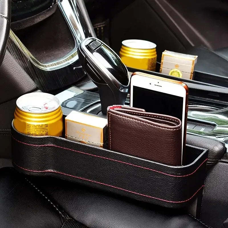 Charging hole feature on seat gap storage box organizer