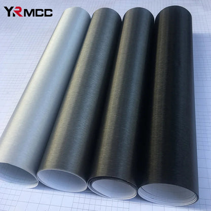 Brushed aluminum vinyl wrap rolls in all four colors silver grey deep grey and black on grid background