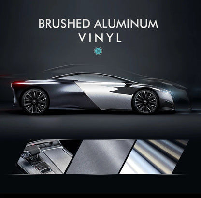 Brushed aluminum vinyl wrap banner showing sports car wrapped in silver sections with interior application close-ups