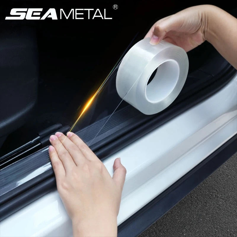 Transparent door sill protection film being applied to car threshold area using hand pressure for adhesion