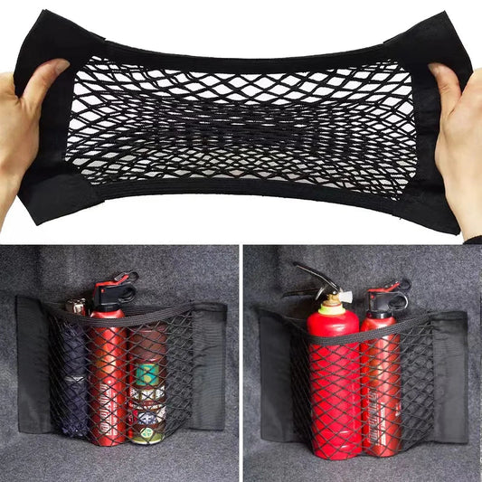 Black trunk cargo net stretched open with fire extinguisher stored in car boot