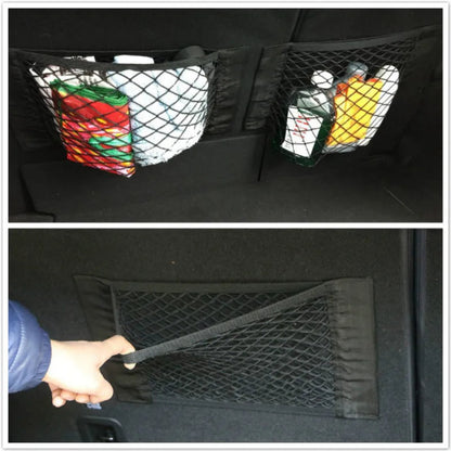 Two trunk cargo nets side by side on boot wall storing groceries and shopping bags