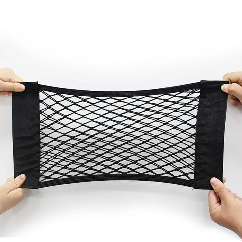 Trunk cargo net held open flat on white background showing mesh and velcro edges