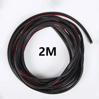 Coiled 2M black U-shape rubber car door edge guard trim strip on white background